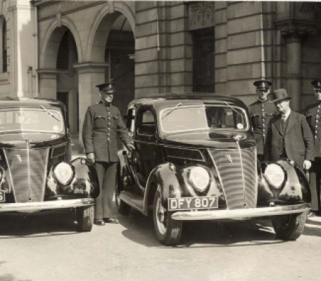 Southport Borough Police taking delivery of their new Ford V8 patrol cars. This rather nice period photo shows the cars DFY 806 and DFY 807 on delivery. From L to R: PC H.B. George Pointon; PC 33 Sam Laycock; PC50 W.C.Russell; Sgt 10 Tony Roach Collection